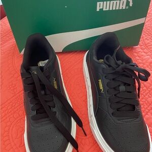 Puma Kids Black Sneakers with White Midsole and Gold Logo